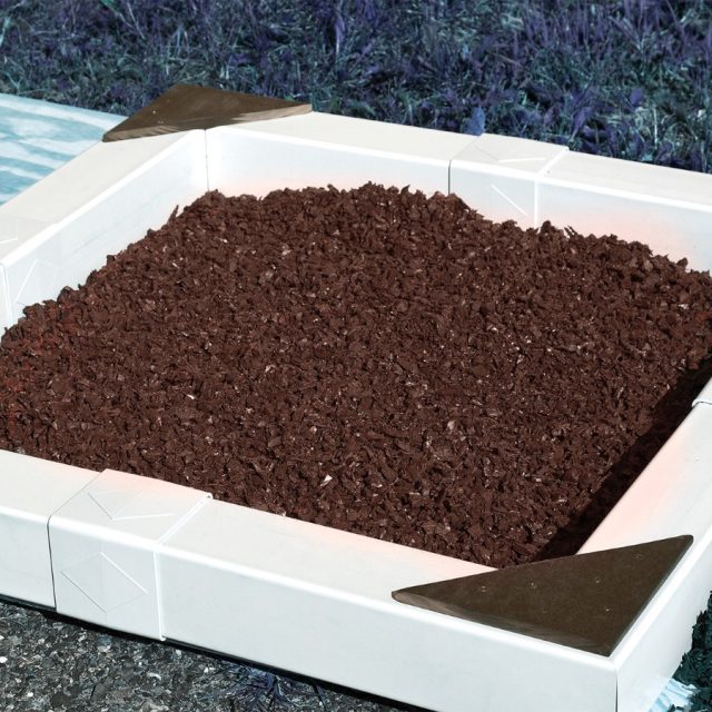brown rubber mulch used to surround base of swing set brown rubber mulch
